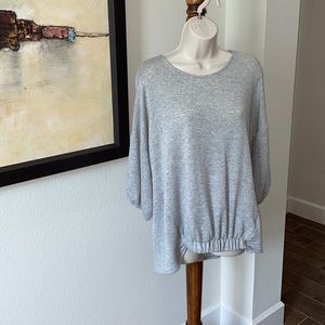 INCREDIBLY SOFT GREY SWEATSHIRT. SZ M elastic on bottom front . touch of unique